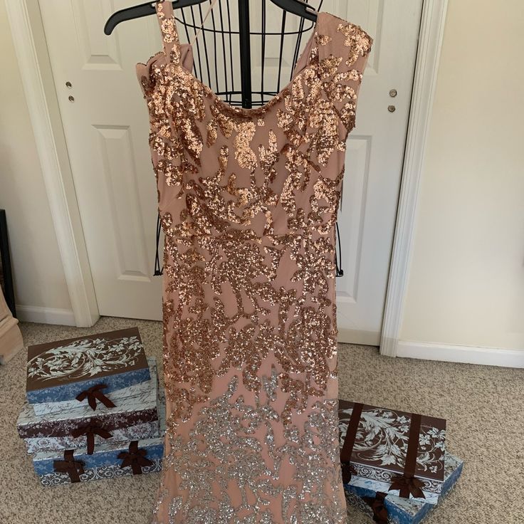 a dress on a hanger in front of a door and some other items next to it