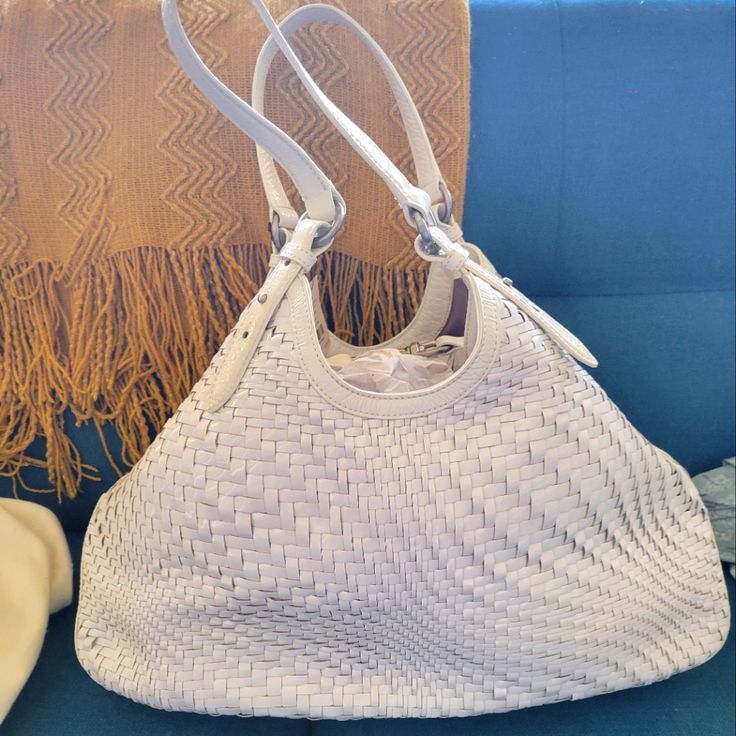 This Og (Circa Y2k) White-On-White Patent Leather Optical Weave Large Tote.In The Vault 20 Yrs In Dust Bag, Ready For A New Home. This Bag Is The Ultimate Statement Of Heritage And Luxury. This Original Edition Bag Is Both Subtle And Stunning, A Gracious Nod To The Artisans Who Built Cole Haan’s Legacy! This Bag Was My 1st Post-College Luxury Investment Bag (Cough 20yrs Ago) I Was Too Afraid To Take It For A Spin, And Life Soldiered On But Kept This Beauty. More In Comments Luxury White Hobo Bag, Luxury White Hobo Bag With Leather Handles, Designer White Hobo Bag For Daily Use, White Top Handle Bag With Intrecciato Weave, White Woven Leather Bag With Top Handle, White Top Handle Bag With Woven Leather, Designer White Hobo Bag, White Satchel Hobo Bag For Shopping, Luxury White Leather Hobo Bag