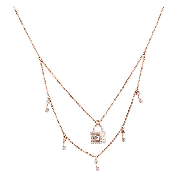 The Lock & Key Diamond Charms Necklace is a stunning piece of jewelry made from 18k solid gold. It features a double-layered design, with one layer showcasing a lock charm and another featuring key charms. The lock pendant is adorned with exquisite diamonds, adding a touch of elegance and sparkle to the necklace. The dual-tone design adds visual interest, with one layer in yellow gold and the other in white gold, creating a beautiful contrast. THE STONES- This necklace consists of a round diamon Luxury Double Chain Double Strand Jewelry, Luxury Double Strand Double Chain Jewelry, Luxury Chain Necklace With Detachable Pendant, Luxury Hallmarked Rose Gold Diamond Necklace, Luxury Yellow Gold Necklaces With Double Chain, Luxury Yellow Gold Double Chain Necklace, Luxury Yellow Gold Necklace With Double Chain, Luxury Yellow Gold Jewelry With Double Chain, Luxury Pendant Chain Necklace With Charms