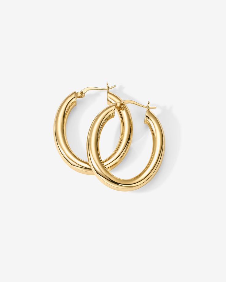 With an elongated sleek silhouette, these hoops are a must-have for the modern woman. Throw them on with a sundress in the summer, or turtleneck and updo in the winter, and look effortlessly chic. 925 Sterling Silver post14KT yellow, rose or white gold platedMeasurements: Width: 25mm (.98”); Height: 30mm (1.12”) Chunky Jewelry, Toggle Bracelet, Beaded Anklets, Bracelet Collection, Chain Earrings, In The Winter, Yellow Rose, Pearl Jewelry, Modern Woman