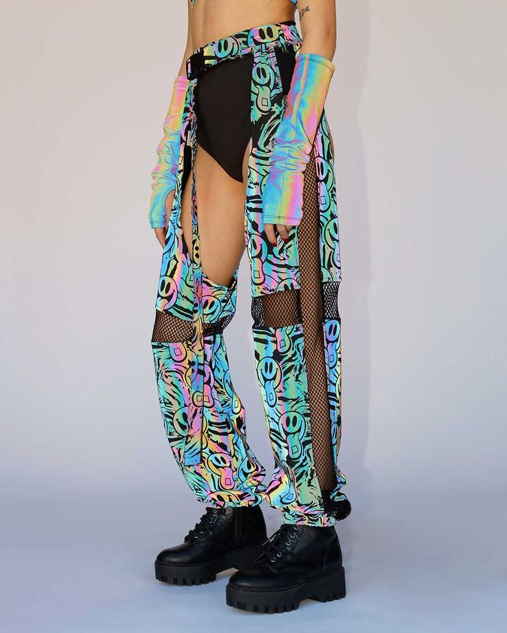 Surrender to the sensory overload brought by the Happy Hour Rainbow Reflective Chaps! These multicolored bottoms have an adjustable waistband and a crazy good UV-reactive print that produces a euphoric neon glow under festival lights. Flash on! Reflective! Stretchy waistband with adjustable belt Booty shorts not included 100% Polyester Body Chain Harness, Chain Harness, Couples Accessories, Glitter Glasses, Sensory Overload, Festival Gear, Face Gems, Fairy Dresses, Festival Shop