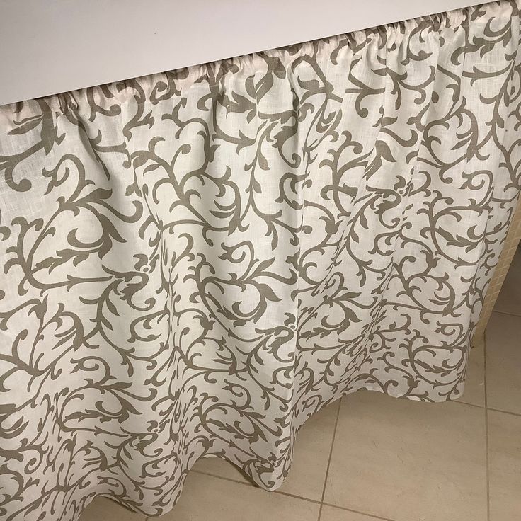 the curtain is hanging on the wall in the bathroom