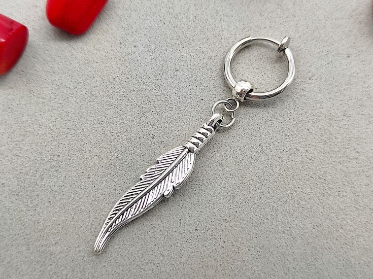 Silver feather clip on, Clip on feather, Men jewellery, Clip on earring, Silver earring for men, Gift for him, Men earring, Silver jewellery ONE feather clip on earring. Total length: 1.9 inches (5 cm) Clip on circle size is 14 mm Single earring, NOT A PAIR! Silver Feather, Men Earrings, Single Earring, Clip On Earrings, Gifts For Him, Silver Earrings, Mens Jewelry, Silver Jewelry, Jewelry Earrings