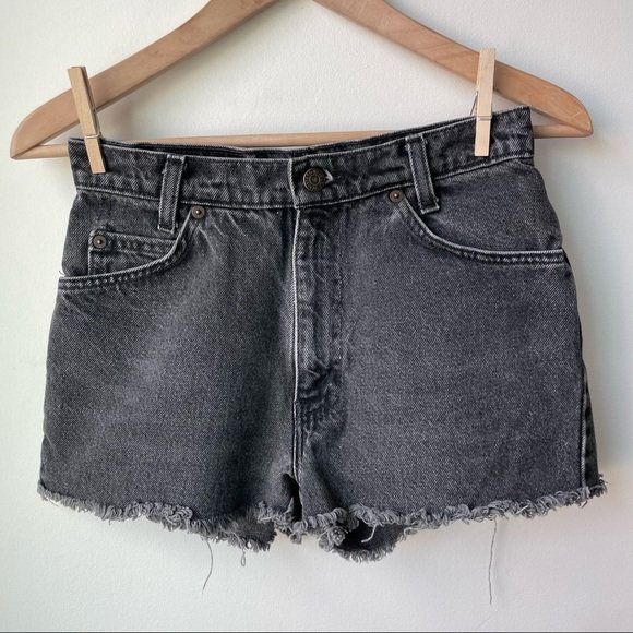 Vintage Orange Tab Levi's Cut Off Denim Shorts. Vintage Student Levi Jeans that have been cut into shorts. High waisted. Charcoal grey acid wash color. Size 28. Excellent condition. Acid Wash Jean Shorts With Frayed Hem, Distressed Gray Bottoms For Summer, Gray Distressed Bottoms For Summer, Summer Distressed Gray Bottoms, Washed Black Denim Cutoff Shorts, Gray Cutoff Jean Shorts For Summer, Gray Jean Shorts For Summer, Summer Washed Gray Bottoms, Gray Cutoff Jean Shorts For Spring