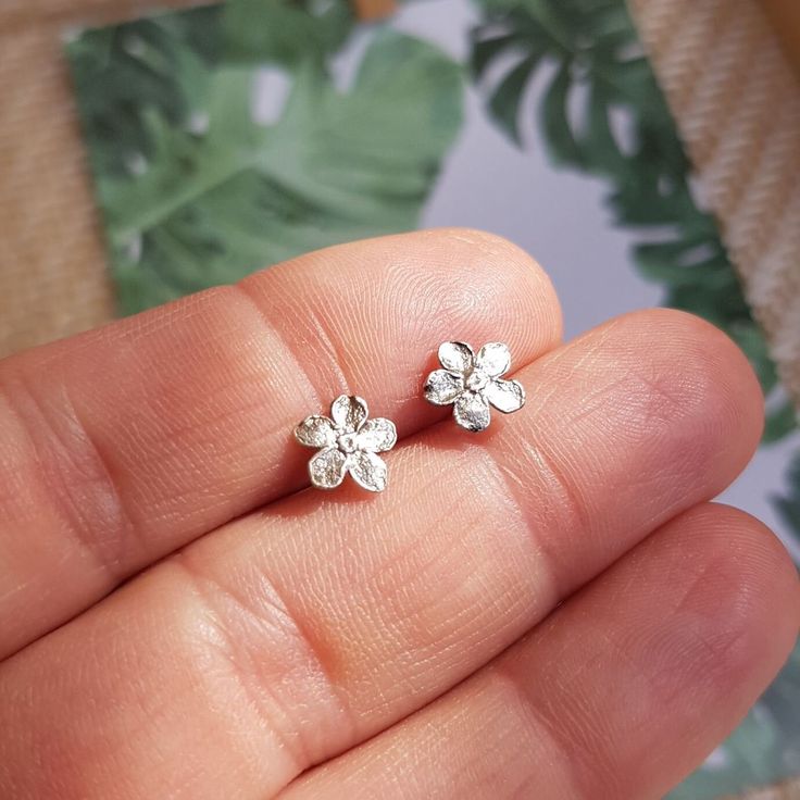 Forget me not earrings studs, Tiny flower ear studs, Silver floral earrings, 4th Anniversary gift for her, Love and Lasting Memories. Tiny forget me not earrings made of silver plated brass and sterling silver. The design based on natural flowers. Measuring at 0.7 cm (0.28 inches), these earrings are a perfect symbol of love and lasting memories, making them a must-have accessory for any occasion. The clasp is crafted from 925 sterling silver, completely free from nickel additives, ensuring that even the most sensitive skin remains allergy-free. Handcrafted with love and attention to detail, these earrings are the perfect accessory to add a touch of whimsy and romance to any outfit. The forget-me-not flowers are delicately crafted from high-quality materials, ensuring their durability and Sterling Silver Flower Earrings For Mother's Day, Sterling Silver Flower Earrings For Anniversary And Mother's Day, Hypoallergenic Silver Flower Earrings For Gift, Silver Jewelry With 3d Flowers For Gift, Nickel Free Flower Shaped Earrings For Mother's Day, Flower-shaped Nickel-free Earrings For Mother's Day, Nickel-free Flower-shaped Earrings For Mother's Day, Hypoallergenic Sterling Silver Flower Earrings For Wedding, Silver Flower Earrings For Gift