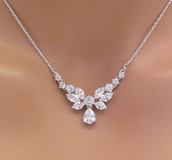 a woman's necklace with diamonds on it