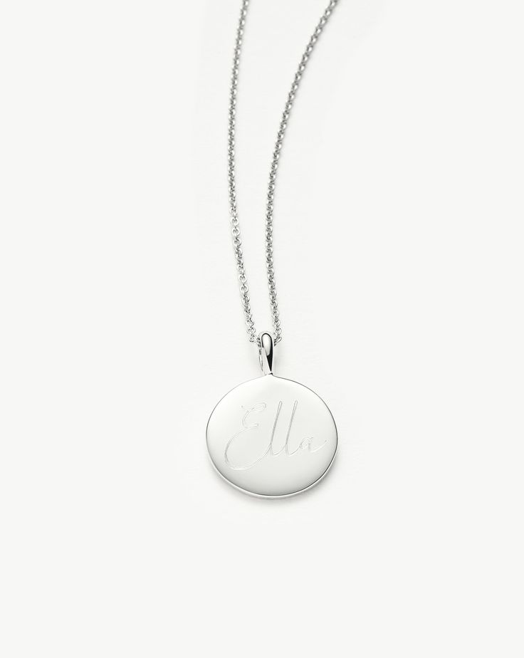 Engravable Round Necklace | Sterling Silver. Make It Personal with a Necklace. Paired with a Delicate Chain, the Smooth Clip-On Pendant Can be Engraved on Both Sides – the Perfect Gift for that Special Someone. Opt for the Engravable Round Disc Pendant. Please Note: Engraving Items May Take 7-10 Working Days to Process. Pendant Metal: Sterling Silver Pendant Dimensions: 15mm Short Plain Chain: Total Length 450mm with Extension Links at 410mm, 430mm and 450mm Weight: 4. 3 Gproduct Code: En-S-N1-Ns Elegant Engraved Charm Necklaces For Formal Occasions, Elegant Everyday Engraved Custom Necklace, Elegant Engraved White Gold Charm Necklaces, Elegant Engraved Charm Necklace With Round Pendant, Elegant Round Engraved Charm Necklaces, Classic Engraved Name Necklace Pendant, Classic Engraved Pendant Name Necklace, Engravable White Gold Jewelry, White Gold Engraved Medallion Charm Necklace