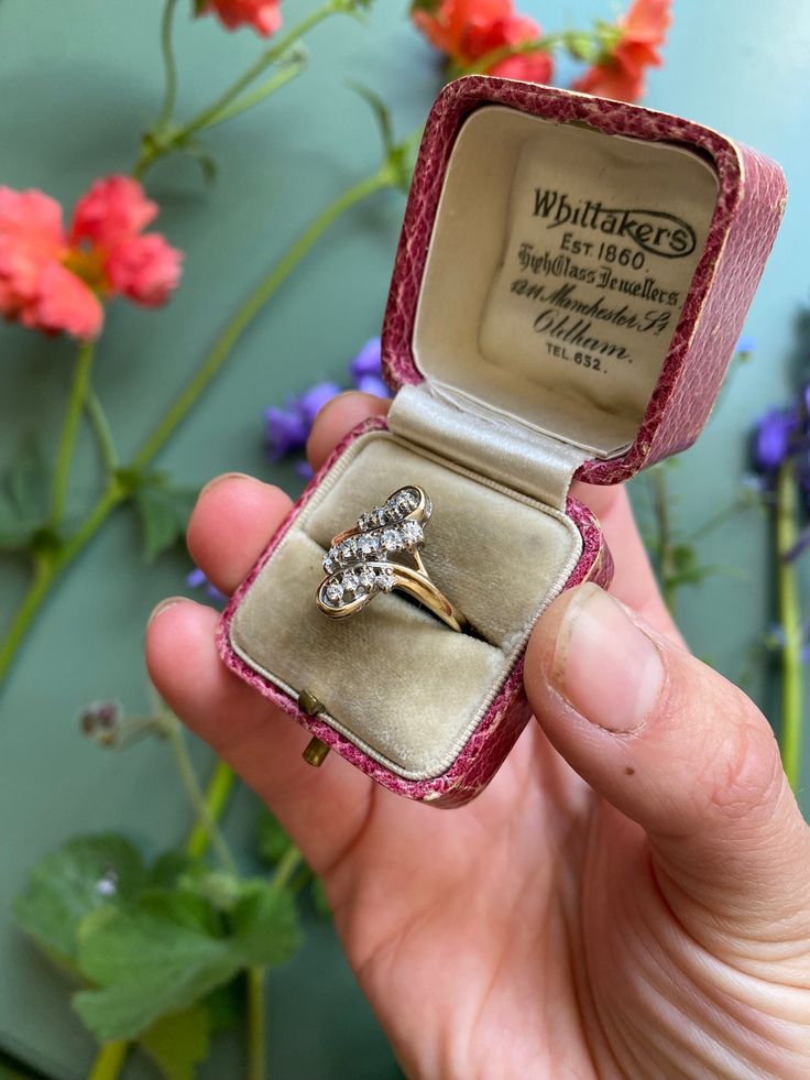 This listing is for a gorgeous vintage 9ct yellow gold cubic zirconia flourish ring.  ✨DETAILS✨ ✨Hallmarks✨ 9ct gold London 1989, makers mark SJ. ✨Gemstones✨ Thirteen round cut sparkling cubic zirconia stones.  ✨Size✨ UK size N1/2, US size 7.25 (resizing possible if needed) ✨Measurements✨ The face of the ring measures 17x9mm  ✨Weight✨ 2.45 grams ✨Condition✨ Good vintage condition ✨EXTRA INFORMATION✨ ✨ Unless otherwise stated all vintage/antique boxes pictured are for display purposes only and are not included in the sale. All ring orders come gift wrapped in a new luxury ring box. We do usually have a selection of vintage/antique boxes available for purchase in our shop if you would prefer an older box. ✨RESIZING - We are able to offer resizing with our experienced local jeweller if needed Vintage Pear-shaped Diamond Ring With Brilliant Cut, Vintage Pear-shaped Brilliant Cut Diamond Ring, Vintage Pear-shaped Diamond Cut Ring, Vintage Hallmarked Pear-shaped Rings, Victorian Brilliant Cut Diamond Ring As Gift, Vintage Cluster Diamond Cut Rings, Victorian Hallmarked Marquise Cut Rings, Victorian Style Brilliant Cut Diamond Ring Gift, Vintage Cluster Rings With Diamond Cut