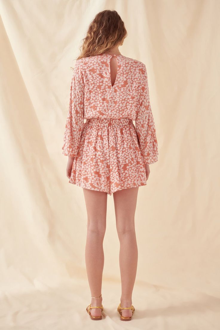 The Free the Roses Bell Sleeve Romper is the perfect piece for your next vacation. Take it with you and be confident knowing that you have an outfit for any occasion. With its lace-up neckline and front cutout detail this romper is perfect for any situation. Hand wash cold Do not bleach Do not tumble dry Iron low Shell: 100% Rayon Lining: 100% Polyester Exclusive of Elastic JJ923P Total length: 32.3" Bust: 37" Inseam: 2.8" S CORAL: Height 5'8" / Bust 32.5" / Waist 23" / Hip 34.5" Floral Print Mini Jumpsuits And Rompers For Day Out, Summer Floral Print Mini Jumpsuits And Rompers, Floral Print Mini Jumpsuits And Rompers For Vacation, Summer Floral Print Mini Jumpsuit Or Romper, Spring Vacation Flowy Jumpsuits And Rompers, Floral Print Mini-length Jumpsuits And Rompers For Vacation, Summer Brunch Jumpsuits And Rompers With Elastic Waistband, Flowy Jumpsuits And Rompers For Spring Brunch, Flowy Jumpsuits And Rompers For Spring Vacation