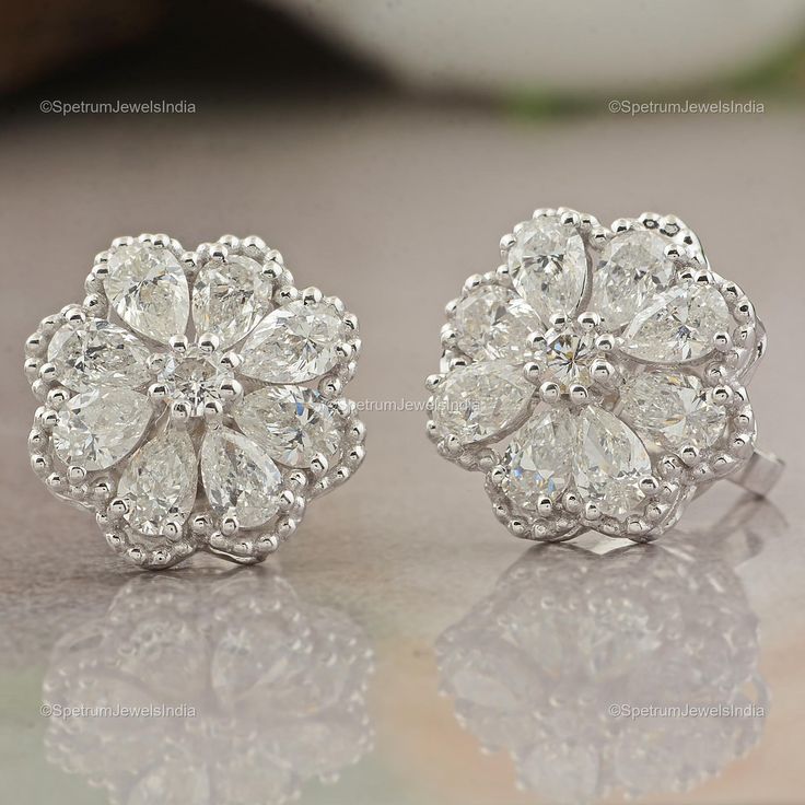 Make yourself trendy and stylish with this 18k White Gold Earrings glittering with Diamond that will add majestic charm and elegance to your look. Exquisitely designed, this Earrings will provide you a classy look. ✧✧Welcome To Our Shop Spectrum Jewels India✧✧ ""Engagement 18k White Gold Diamond Earrings, Natural Diamond Jewelry, Stud Earrings For Anniversary Gift, Valentine Gift For Wife"" ★PRODUCT SPECIFICATION★ * ITEM CODE - SEE-11047 * METAL - 18k White Gold * 18k White Gold Weight : 4.1 gm Luxury White Diamond Cut Cluster Earrings, Luxury White Cluster Earrings With Diamond Cut, White Diamond Cut Cluster Earrings For Anniversary, White Cluster Diamond Earrings With Halo Design, Dazzling White Gold Cluster Earrings For Anniversary, Luxury White Cluster Earrings For Anniversary, White Cluster Halo Diamond Earrings, Anniversary White Diamond Cut Cluster Earrings, White Cubic Zirconia Flower Bridal Earrings