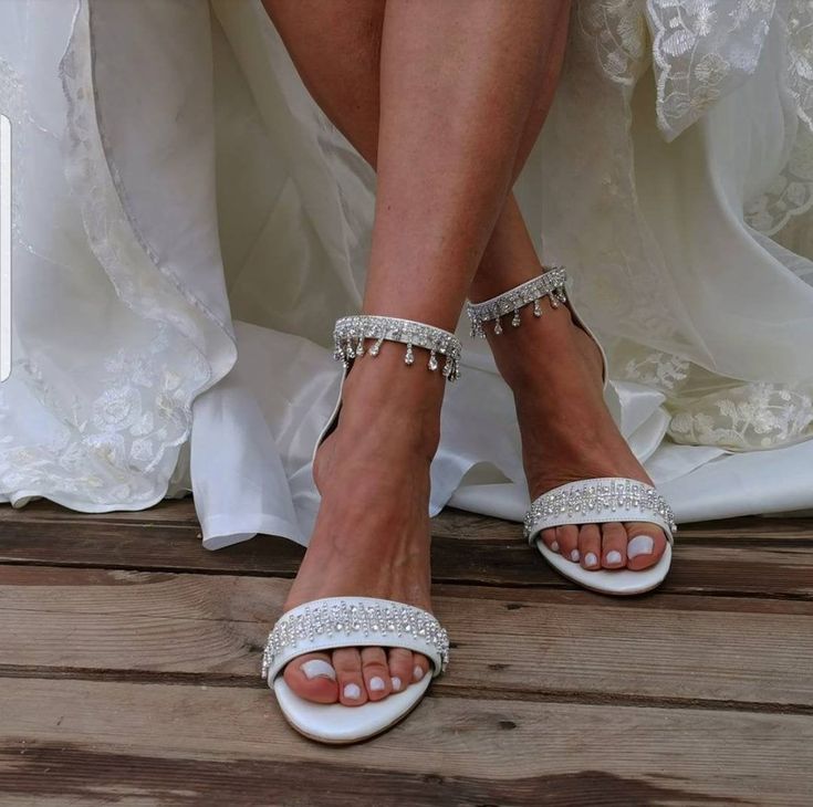 "Bridal sandal with decorative band. It has a thick heel 8 cm - 5 cm and ties at the ankle with an adjustable decorated with a crystal rhinestone strap. Our sandals are designed for flexibility, they have a leather sole with a special foam. Whatever the occasion, bridal sandals will keep you glowing and comfortable. The best thing? They can be worn again after the wedding! All Pelino shoes are made to ensure the highest level of comfort throughout your special day. Heel Height: 8 cm/3.15\" (pict Wedding Sandals With 4-inch Heel And Round Toe, Wedding Heels With Heel Strap And Single Toe Strap, Elegant Single Toe Strap Sandals For Wedding, Silver Sandals With Heel Strap For Wedding, Elegant Single Toe Strap Heels For Wedding, Elegant Heels With Single Toe Strap For Wedding, Wedding Heels With 4-inch Heel And Single Toe Strap, Elegant Wedding Heels With Single Toe Strap, Wedding Sandals With Heel And Toe Straps