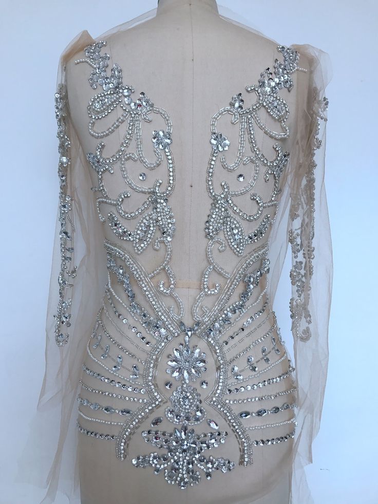 Silver Rhinestone Gown For Prom, Silver Rhinestone Gown For Prom Season, Fitted Silver Evening Dress With Rhinestones, Silver Gown With Rhinestones For Party, Elegant Silver Crystal Dress, Silver Floor-length Gown With Rhinestones, Silver Rhinestone Wedding Evening Dress, Elegant Silver Dresses With Crystal Material, Silver Rhinestone Evening Dress For Wedding