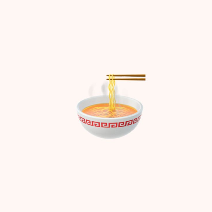 a bowl of soup with chopsticks sticking out of it