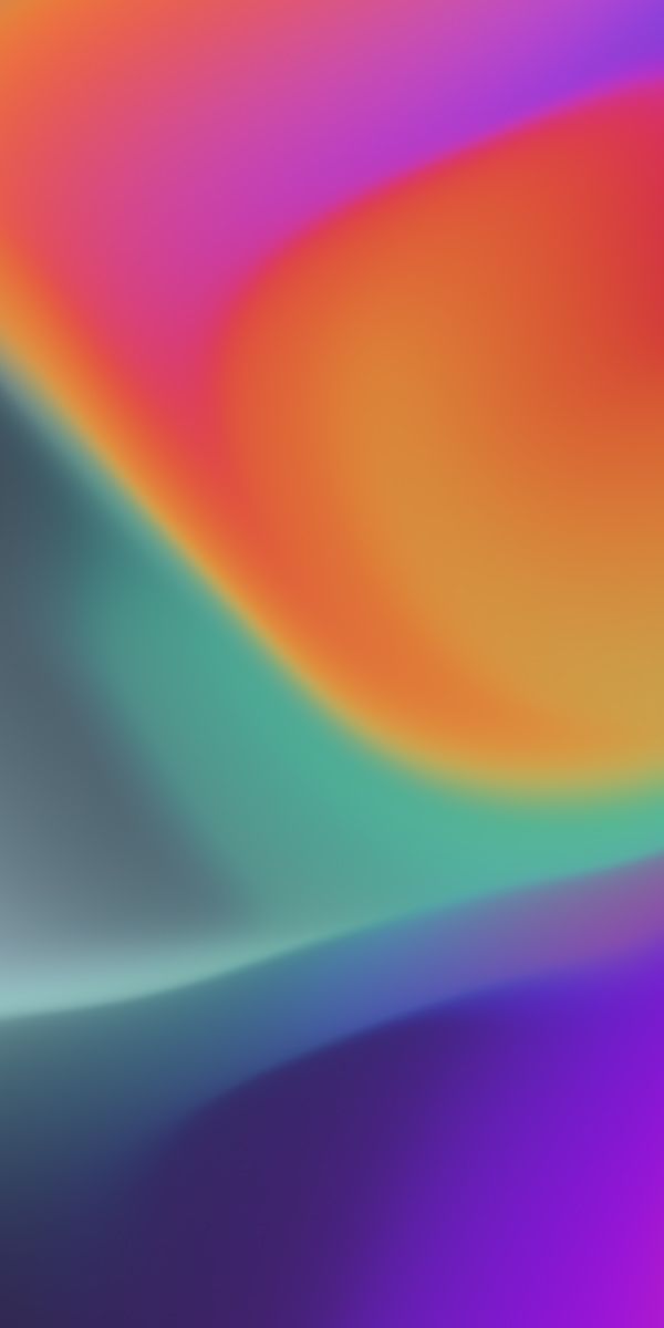 a blurry image of an orange and blue background with some colors in the bottom right corner