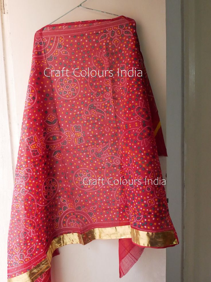 Red cotton Bandhani dupatta with golden gota border on one side. Traditional Indian red art scarf. It is used mostly for wedding purposes. Dimension: Length: 2.18 meter Width: 1.05 meter Red Chanderi Saree With Bandhani Print, Red Bandhani Print Chanderi Choli, Bohemian Red Traditional Wear With Bandhani Print, Red Bohemian Traditional Wear With Bandhani Print, Red Bandhani Print Traditional Drape, Red Bandhani Print Traditional Wear, Red Bandhani Traditional Wear, Red Bandhani Print Dupatta For Festive Occasions, Bohemian Red Choli With Bandhani Print