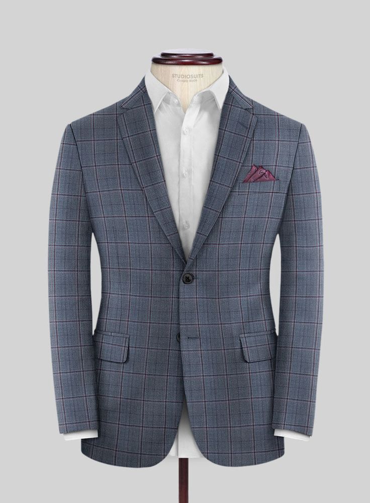 Put together a dapper and stylish formal look by wearing our Reda Tropical Blue Checks Wool Suit. Made from high-quality wool that feels exceptionally soft and has a lightweight finish. The subtle checkered texture created with brown threads and a classy tropical blue color palette makes this suit a standout choice for any glamorous event or an important meeting. Rest assured that this ensemble will set you apart. 
  Look Includes    Reda     Tropical     Blue     Checks     Wool  Fabric  Two Bu Luxury Plaid Single Breasted Suit, Dapper Business Blazer In Suiting Fabric, Luxury Fitted Plaid Blazer, Luxury Long Sleeve Plaid Suits, Luxury Plaid Long Sleeve Suits, Luxury Plaid Suit For Office, Elegant Plaid Blazer For Business, Elegant Plaid Suit For Semi-formal Occasions, Luxury Plaid Suits With Suit Collar