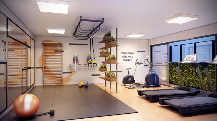 an exercise room with treadmills and yoga mats