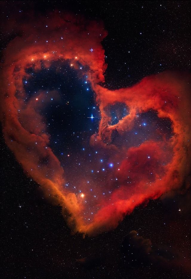 a heart shaped cloud in the sky with stars and lightening from it's center