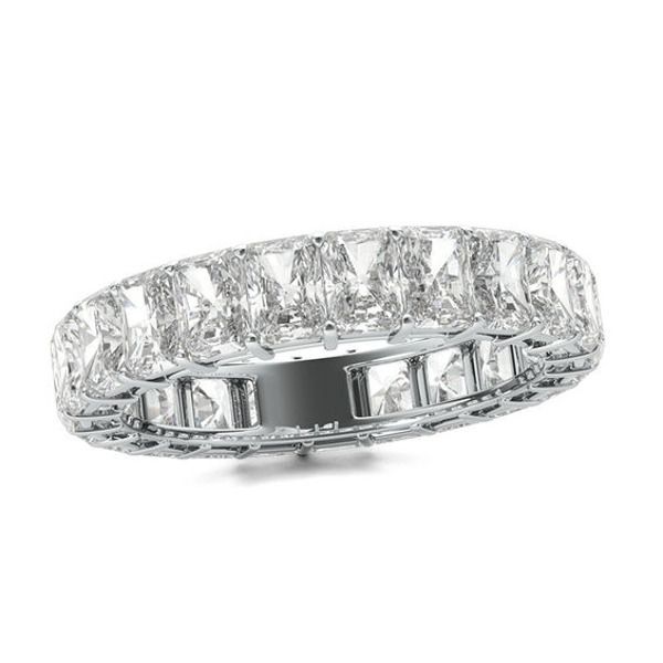 A stunning celebration of your commitment, this fancy-shape diamond eternity band is a confident choice for your bride or bride-to-be. Expertly crafted in sleek platinum, this sensational style showcases sparkling 1/5 ct. radiant-cut diamonds - each boasting a color rank of G and clarity of VS2 - that surround the endless band. This breathtaking design is beguiling on its own or paired with her diamond solitaire. Dazzling with 5 cts. t.w. of diamonds and a brilliant buffed luster, this eternity Radiant Cut Diamond Eternity Band For Anniversary, Radiant Cut Diamond Eternity Band Fine Jewelry, Diamond White Asscher Cut Eternity Band, Radiant Cut Brilliant Diamond Eternity Band For Anniversary, Asscher Cut Diamond Eternity Band In Diamond White, Elegant Radiant Cut Diamond Eternity Band, Asscher Cut Diamond Eternity Band With Brilliant Cut, Asscher Cut Diamond White Eternity Band, White Asscher Cut Elegant Eternity Band