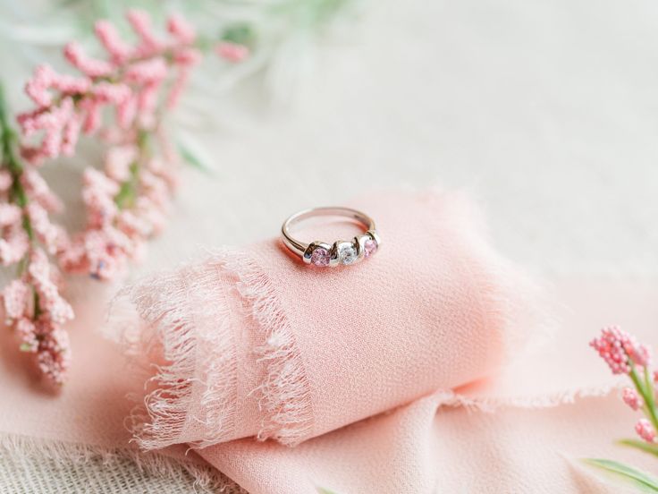 Sterling Silver baby ring featuring twisted band with pink and clear CZ stones. This is a beautiful way to celebrate the birth of a new baby or wonderful birthday gifts too! Ring comes in a beautiful black velvet heart-shaped box. Available in sizes 1-4 Ring Sizing: https://cherishedmomentsshop.com/pages/sizing-charts Cubic Zirconia Jewelry With Side Stones For Gift, Fine Jewelry Rings With Side Stones As Gift, Heart Cut Birthstone Rings For Birthdays, Gift Cubic Zirconia Ring With Side Stones, Heart Cut Birthstone Rings For Birthday, Cubic Zirconia Rings With Side Stones For Gift, Cubic Zirconia Rings With Side Stones As Gift, Fine Jewelry With Side Stones As A Gift, White Gold Jewelry With Side Stones As Gift