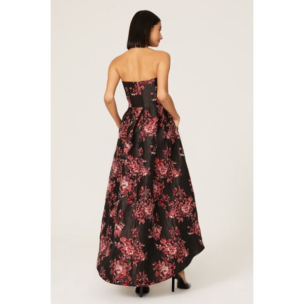 Black floral jacquard (86% Polyester, 14% Metallic). A-line gown. Strapless. Sleeveless. Back zipper closure. 58" from top to hemline. Imported. Black Tie Wedding Attire, Velvet Gowns, Wedding Attire For Women, Hi Low Gown, Black Tie Dress Code, Floral Frocks, High Low Gown, Floral High Low Dress, Mob Dresses