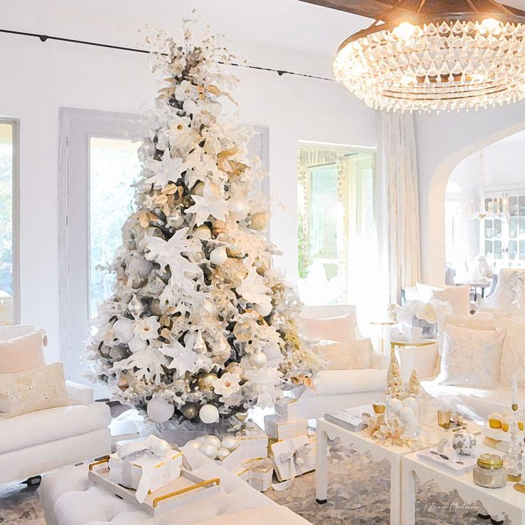 a white christmas tree in a living room