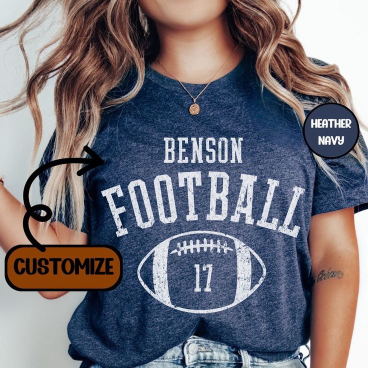 Elevate your Football Game day apparel with this Unisex super soft Customized football shirt.  Customize the front with your school of choice & players number.  These shirts are perfect for men or women. These shirts are made of high-quality cotton.  Thank you for browsing our shop, we hope you find something you enjoy! If there is a shirt color not shown that you want, write in personalization field and we can make it happen. *Check out our other sports options here* https://www.etsy.com/shop/D Casual Cheap Tops With Team Name, High School Football Tshirt Designs, Personalized Football Shirts, Collegiate T-shirt With Custom Print For Game Day, Varsity T-shirt With Team Logo For Football Season, Varsity T-shirt For College Football Season, Customizable T-shirt For Football Season, Football Game Day Shirts, Varsity Football Season Fan Gear T-shirt