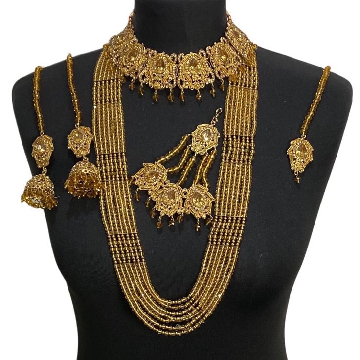 Jewellery set. Set includes- Earrings  Necklace Tikka Jhumar Mala Gold Jewelry With Stone Work For Celebration, Gold Chandbali Jewelry Sets Hand Set, Gold Temple Jewelry Sets With Tilla, Heavy Gold Plated Jewelry Sets For Festivals, Bollywood Yellow Gold Jewelry With Latkans, Bollywood Style Yellow Gold Jewelry With Latkans, Diwali Gold Jewelry With Stone Work, Diwali Heavy Gold Plated Jewelry, Gold Chandbali Jewelry With Tilla Detailing