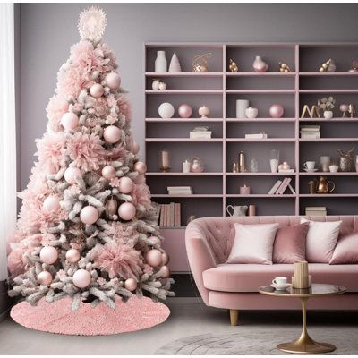 a pink christmas tree in a living room