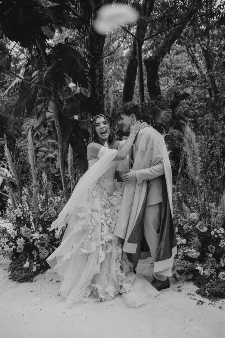 black and white photo of bride and groom in the woods