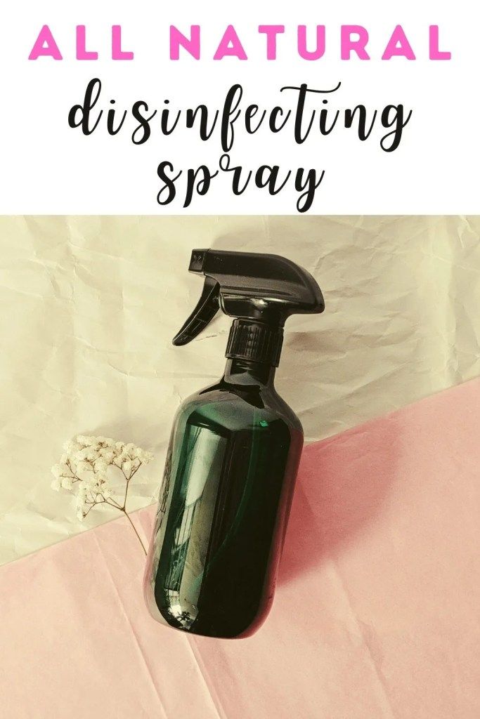 an all natural disinfecting spray on a pink and white background with text overlay