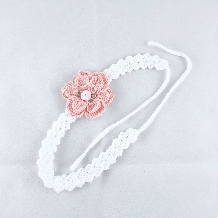 Crochet flower headband, fits age 3 years to adult. Measures 34cm + ties, flower appliqué measures 6.5cm diameter. Made from 100% cotton. Bohemian White Headband, Summer Adjustable Handmade Flowers Headband, Summer Adjustable Headband With Handmade Flowers, Adjustable Summer Headband With Handmade Flowers, Bohemian White Headband For Spring, White Bohemian Headband For Spring, Adjustable Flower Headband For Summer, Summer Gift Headpiece With Matching Headband, Handmade White Bohemian Headband