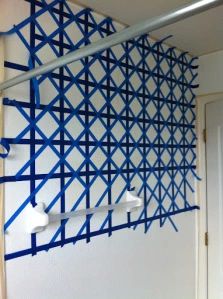 a wall with blue and white lines on it