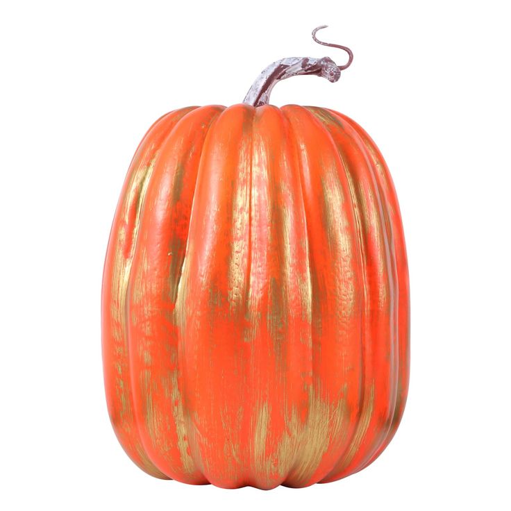 an orange pumpkin with gold stripes on it