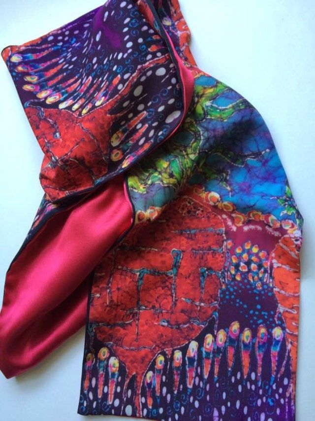 This is a very rich, handsome silk scarf from a favorite original batik. The scarf is 8" x 70" And 4.5 " x 70"Please click on all images at the bottom to get a full picture of this scarf. This scarf is custom printed from my original batik "Below it All - Roots in Garden" on silky faille fabric and backed with sateen. It has a warm and luxurious feel with a lovely drape to the fabric as well as being wrinkle resistant.     The yellows, reds, blues, greens and orange colors give a happy energetic Multicolor Printed Silk Scarf, Bohemian Batik Print Silk Scarf, Patterned Silk Scarf As A Gift, Patterned Silk Scarf Shawl, Patterned Silk Shawl Scarf, Multicolor Silk Scarves For Festivals, Multicolor Print Silk Scarf, Bohemian Hand-dyed Multicolor Silk Scarf, Bohemian Silk Scarf With Batik Print