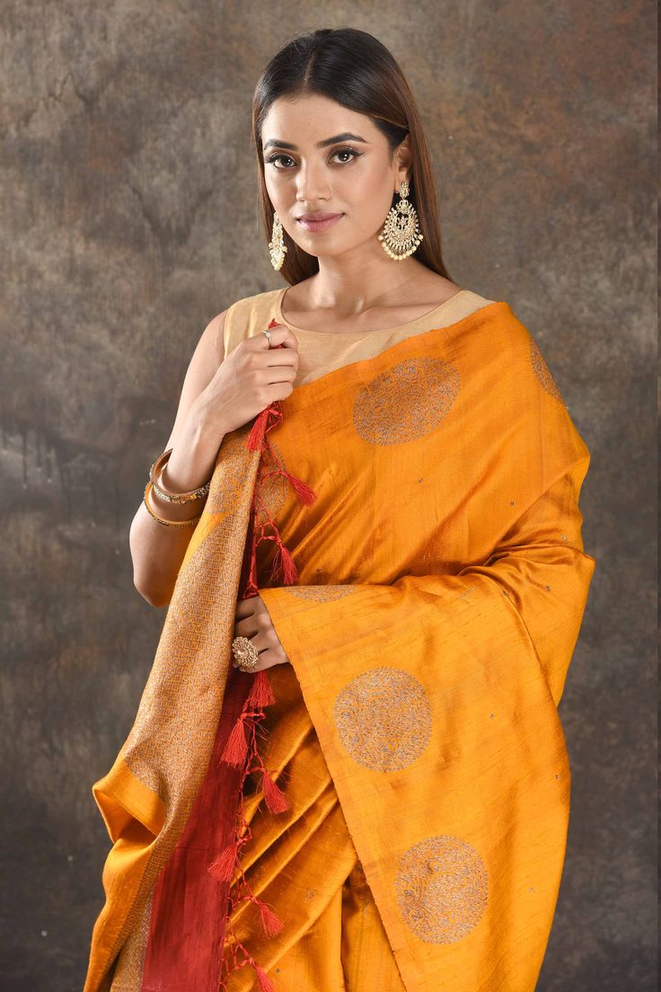 Be vision of elegance on special occasions in this mango yellow tussar Banarasi saree. The saree is enhanced with antique zari buta and pallu. It comes with a red blouse piece. Disclaimer: The actual product may vary slightly from the image. These are custom orders, hence expect slight variation in color, placement of the motif or buta. ESTIMATED DELIVERYBecause this is a custom order, it would take about 4 weeks from the date of purchase. RETURN POLICYThis product is a custom order and cannot b Banarasi Sari, Sarees Banarasi, Mango Yellow, Fashion Journals, Red Blouse, Banarasi Saree, Indian Saree, Traditional Fabric, Designer Sarees