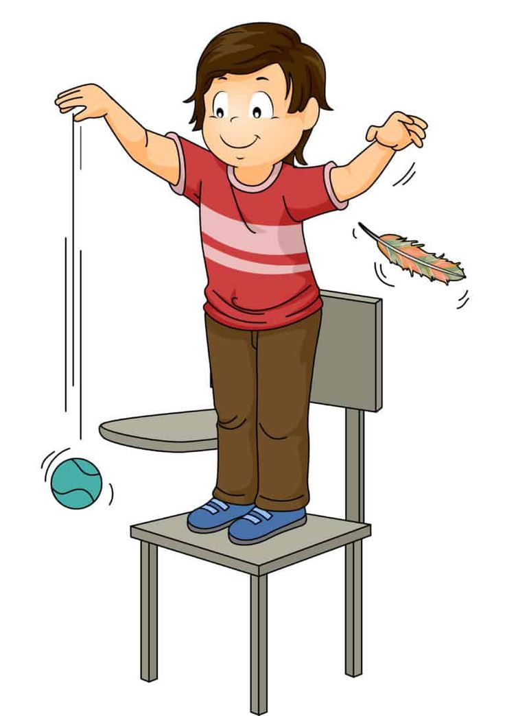 a boy standing on top of a chair with his arms spread out and throwing something in the air