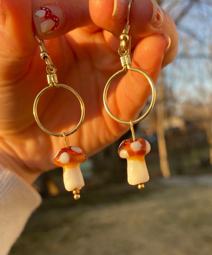 Dangle mushie earrings Whimsical Gold Earrings With Mushroom Design, Whimsical Gold Mushroom Earrings, Whimsical Mushroom-shaped Earrings For Gifts, Mushroom Design Dangle Earrings As Gift, Mushroom Design Dangle Earrings For Gift, Cute Dangle Earrings With Mushroom Design, Nickel-free Mushroom Shaped Earrings As Gift, Nickel-free Mushroom-shaped Earrings For Gifts, Cute Mushroom Design Dangle Earrings