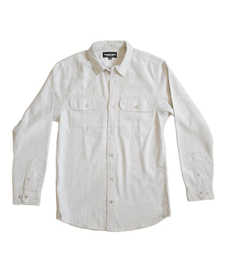 Beige white long-sleeved button-up shirt. It has a classic collar and two chest pockets with button closures. The shirt has a relaxed, casual style with a straight cut. There's a small black label visible at the collar, The Lomas Brand is printed on the tag in white. The shirt is presented flat against a plain white background, giving it a clean, minimalist look. Everyday Shirt With Placket For Fall, Fall Season Everyday Shirt, Everyday Relaxed Fit Button-up Shirt, Classic Everyday Flannel Shirt With Button Closure, Fall Unstructured Button-up Shirt, Relaxed Fit Collared Flannel Shirt For Spring, Classic Shirt With Snap Buttons For Everyday, Classic Relaxed Fit Flannel Shirt For Fall, Classic Relaxed Fit Flannel Shirt