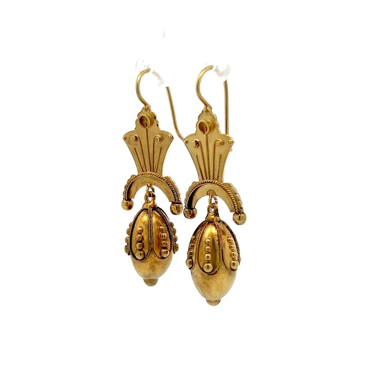 Step back in time with these exquisite Victorian drop earrings, truly a treasure from the 19th century. Crafted in 15 karat yellow gold, these antique earrings showcase the ornate detailing characteristic of the Victorian era. Each earring features intricate scrollwork and hollow elements that contribute to their lightweight feel, making them comfortable for all-day wear. These elegant drop earrings are perfect for anyone who appreciates the beauty of antique jewelry and the rich stories they hold. A timeless set of earrings that add a touch of history and elegance to any outfit! Luxury Victorian Yellow Gold Pearl Earrings, Luxury Yellow Gold Victorian Pearl Earrings, Classic 22k Gold Earrings, Antique Yellow Gold Ceremonial Earrings, Historical Yellow Gold Drop Earrings, Yellow Gold Historical Drop Earrings, Yellow Gold Drop Earrings With Historical Design, Victorian Yellow Gold Drop Earrings, Vintage Ceremonial Drop Earrings