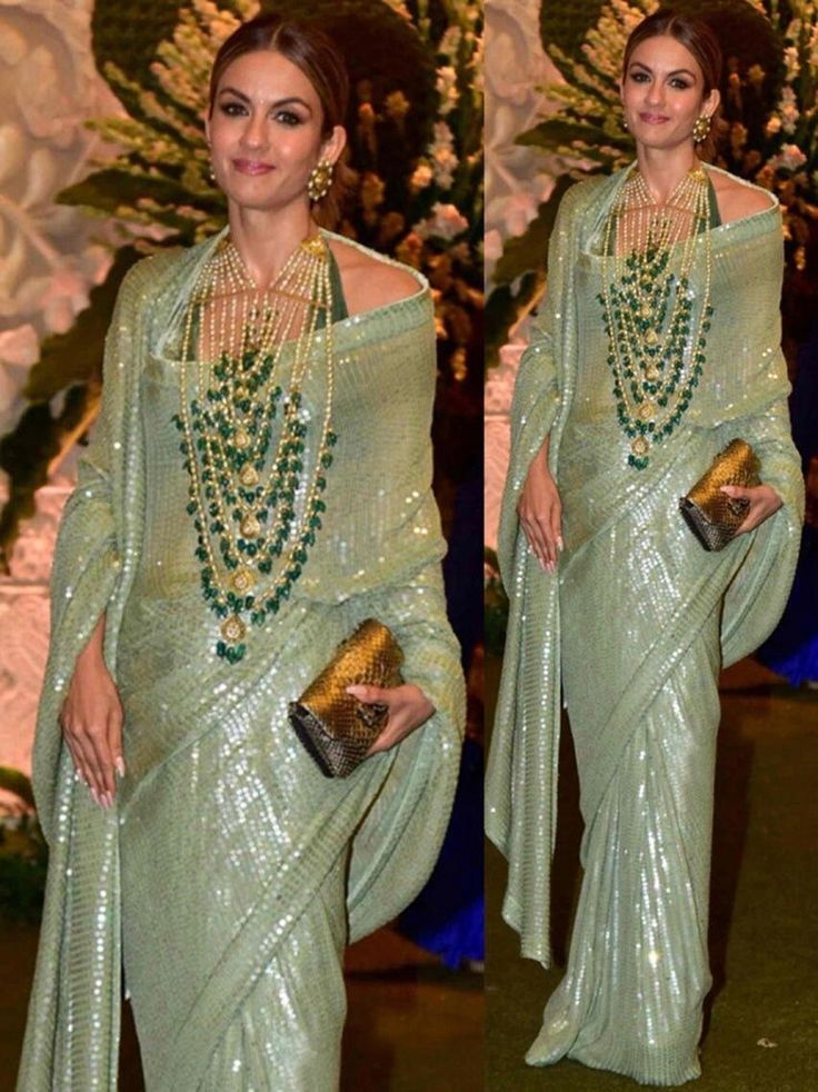 Beautiful Manish Malhotra inspired sequin sari.  The base is a georgette fabric that is hand dyed to a dusty green color  The blouse fabric is a matching Green Art Raw Silk.  Sari Length: 5.5m Blouse Fabric: 1m   MEAUREMENTS & CUSTOMIZATIONS   If you want the blouse stitched, please choose the 'Stitched' option from the 'Blouse' drop-down menu.  This blouse can be purchased in your standard sizing and pattern. Please choose your 'Chest Size' (measured in Inches) from the drop-down box. All our blouses come with in-built padding and hooks at the back for closure.    For custom sizing please include the below measurements in the the notes whenever you placed the order.  * Chest size: * Waist size: * Blouse Length: * Bicep: * Arm-hole: * Sleeve Length: * Front Neck Depth: * Back-Neck Depth: Cocktail Sarees, Manish Malhotra Saree, Cocktail Outfits, Green Sari, Sequins Saree, Bollywood Sarees, Sequence Saree, Sequin Saree, Beautiful Lipstick