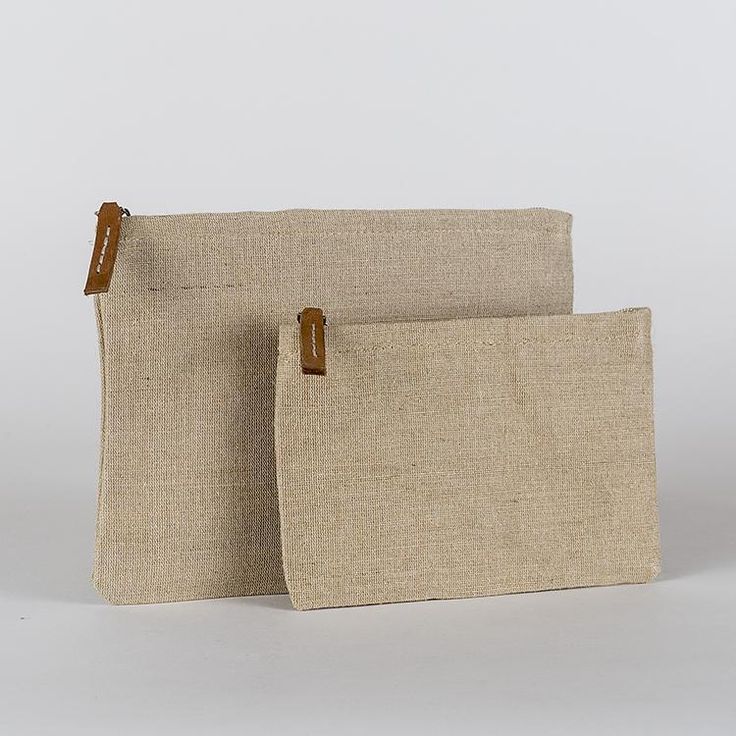 Jute is an amazing natural and sustainable material, so we made a set of zippered pouches in a size that works well for so many things. With a striped cotton lining and leather pull, it's perfectly elegant on its own or as an organizer in your bag or backpack. Set of two. Everyday Beige Zipper Pouch, Natural Rectangular Everyday Pouch, Everyday Natural Rectangular Pouch, Daily Use Beige Pouch With Zipper Pocket, Everyday Beige Pouch With Zipper Pocket, Eco-friendly Natural Color Pouch For Everyday, Eco-friendly Everyday Rectangular Pouch, Eco-friendly Zipper Pouch Bag, Eco-friendly Rectangular Everyday Pouch