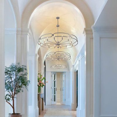 the hallway is clean and ready for guests to use it as an entrance way in this home