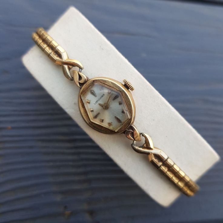 "Antique absolutely gorgeous ladies wrist watch by Longines. It features the original mechanical movement and dates back to the 1963. Watch features a Speidel stretchable band that forms to your wrist at almost any wrist size. The watch is marked on the back \"10K Gold Filled\". Movement: Longines Watch Co. Swiss Movement Serial Number:12476498. Jewels: 17j. Case: Longines - Wittnauer Watch Co. Inc. - New York - Geneva - Montreal - S&W.  Case Grade: 10K Gold Filled. Serial Number: 413349. Measures: 16 mm with crown. Weight: 0.4 oz. (12 grams). Vintage Longines watch is in good pre-owned condition. Not running. Very rare and collectible model. A perfect gift for women and a nice addition to any watch collection. A very scarce and beautiful time piece, your investment in this watch will neve Longines Watch Ladies, Dior Watch, Ladies Wrist Watch, Art Deco Watch, Antique Costume Jewelry, Longines Watch, Vintage Watches Women, Antique Watches, Womens Watches Luxury