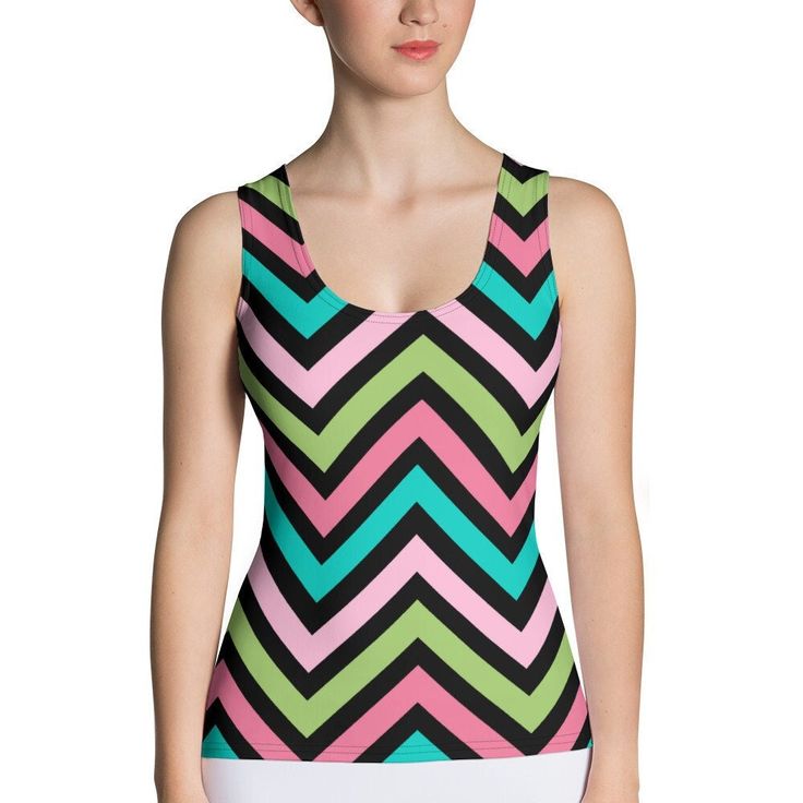 This attractive body-hugging tank top is a must-have for every activewear collection! Featuring multi-colored V-shaped design, this comfortable tank top is figure-hugging and sits just below the hips. Thanks to its smooth microfiber yarn and stretchy material, the top is perfect for both active training or a casual day out. The fabric absorbs moisture from the skin and dries quickly. Perfect wear for summer! * 82% polyester, 18% spandex * Fabric weight: 6.78 oz/yd² (230 g/m²) (weight may vary by 5%) * four-way stretch, which means fabric stretches and recovers on the cross and lengthwise grains * Made with a smooth, comfortable microfiber yarn * Precision-cut and hand-sewn after printing If you are in between sizes or curvy or would like to wear it a little loose, we suggest ordering a siz Sporty Sleeveless Multicolor Tops, Multicolor Sleeveless Sports Top, Multicolor Stretch Racerback Activewear, Multicolor Sleeveless Activewear For Gym, Multicolor Sleeveless Gym Tops, Fitted Sleeveless Color Block Top, Multicolor Stretch Sleeveless Activewear, Fitted Multicolor Tank Top For Gym, Stretch Sleeveless Color Block Activewear