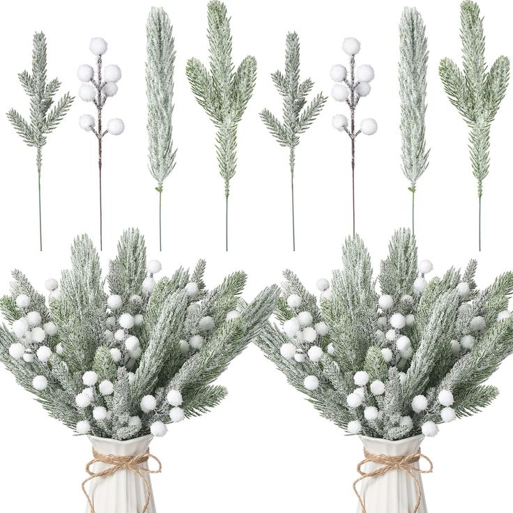 two vases filled with white balls and greenery