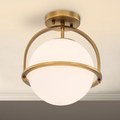 a light fixture hanging from the ceiling in a room