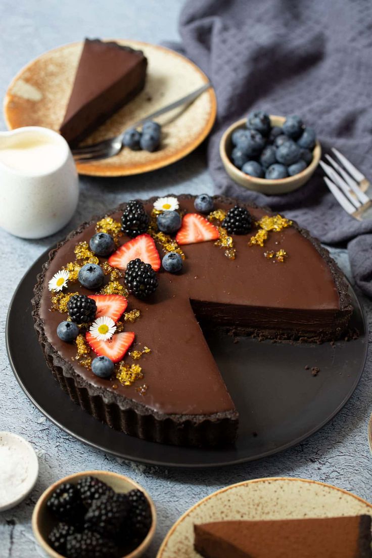 there is a chocolate cake with berries on it