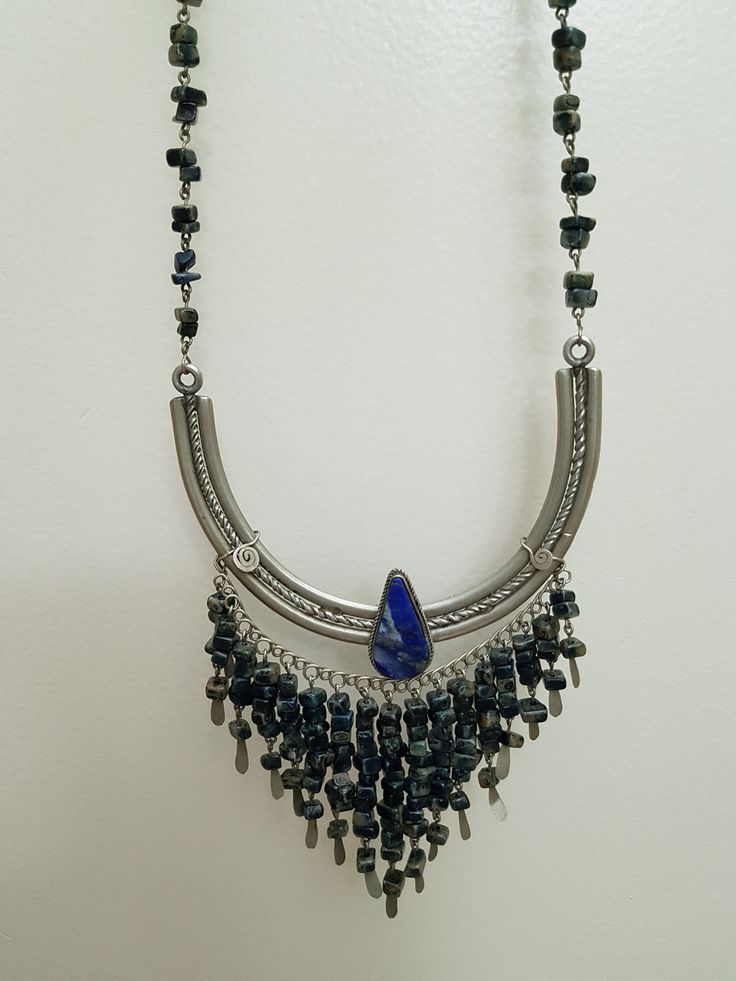 Vintage Peruvian Lapis Silver Bib Style Necklace,, lovely craftsmanship.. each stone is linked with silver wire and a nice Lapis stone inlaid in silver ornate metal is the center pieces.. shorter style necklace.. 15 inches Artisan Antique Silver Nickel-free Necklace, Silver Bohemian Jewelry With Natural Stones, Bohemian Silver Jewelry With Natural Stones, Bohemian Metal Jewelry With Silver Beads, Metal Dangle Necklaces With Natural Stones, Metal Necklaces With Natural Stones Dangle, Bohemian Sterling Silver Necklace With Silver Beads, Adjustable Antique Silver Bohemian Necklace, Bohemian Sterling Silver Beaded Dangle Necklaces