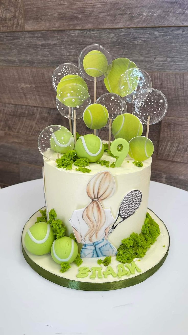 a tennis themed cake with green decorations